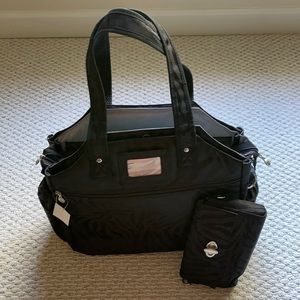 New black w/ zebra print tennis/weekender tote. Comes w/ purse an shoulder strap